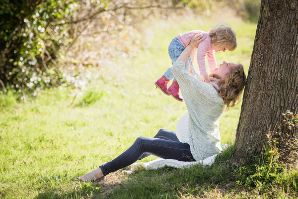 woman holding pelvic floor and baby