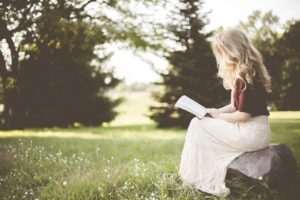 woman reading a book patiently